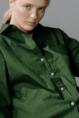 woman in a green shirt