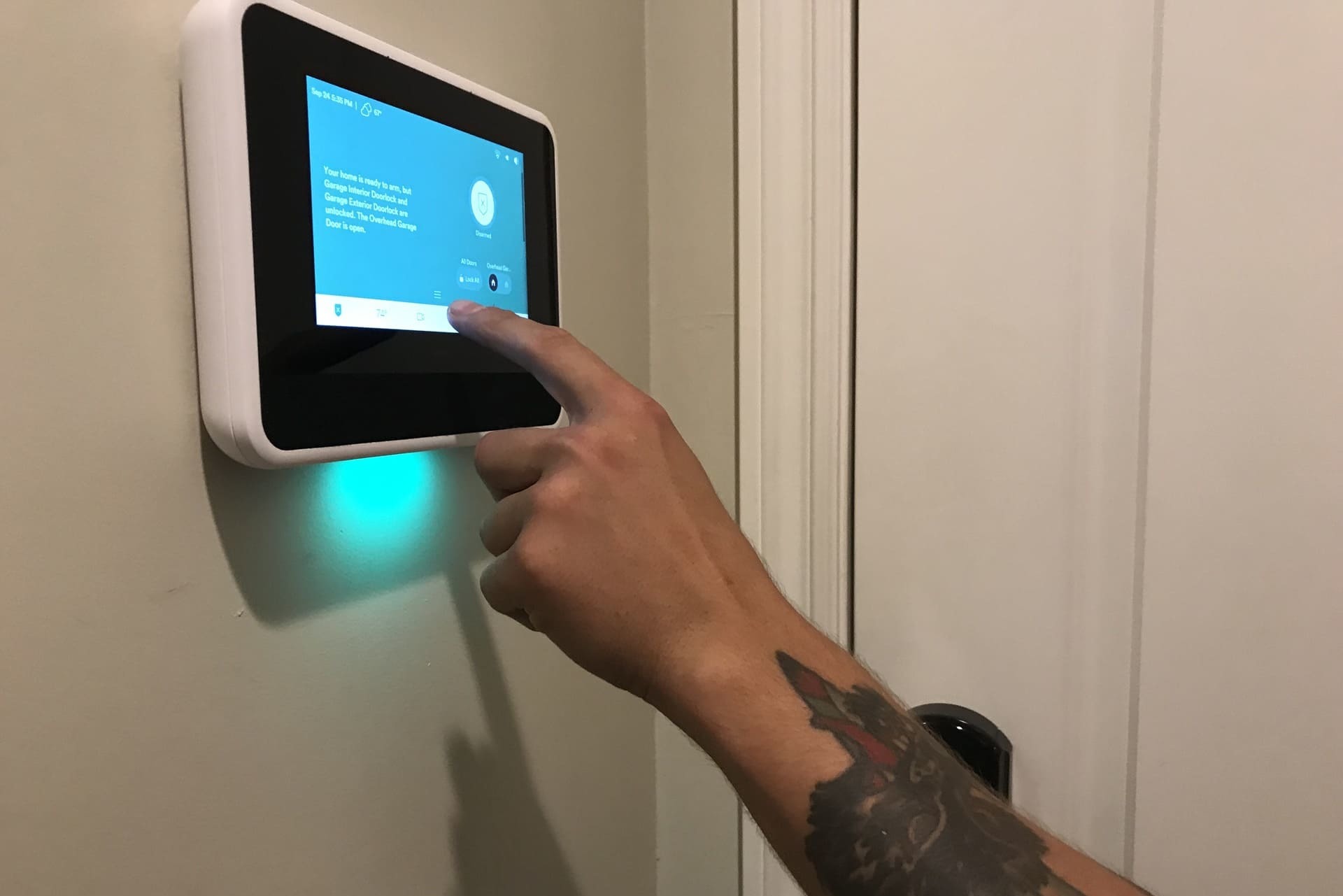 A Technician gives instructions on Programming the home security panel in a smart home.